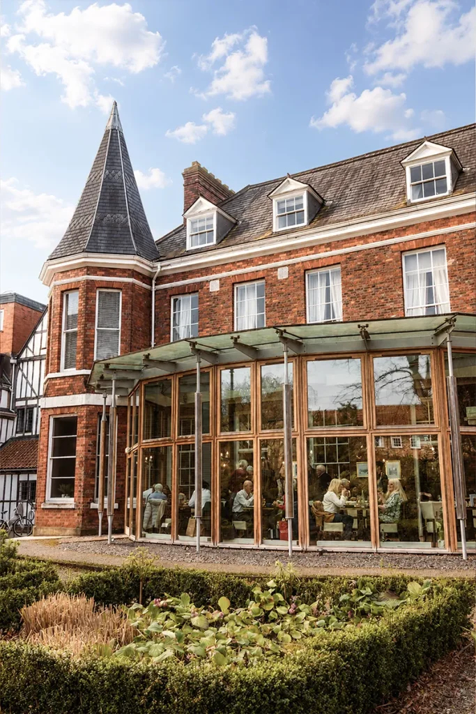 Exterior view of La Vecchia Scuola's historic restaurant building and conservatory in York