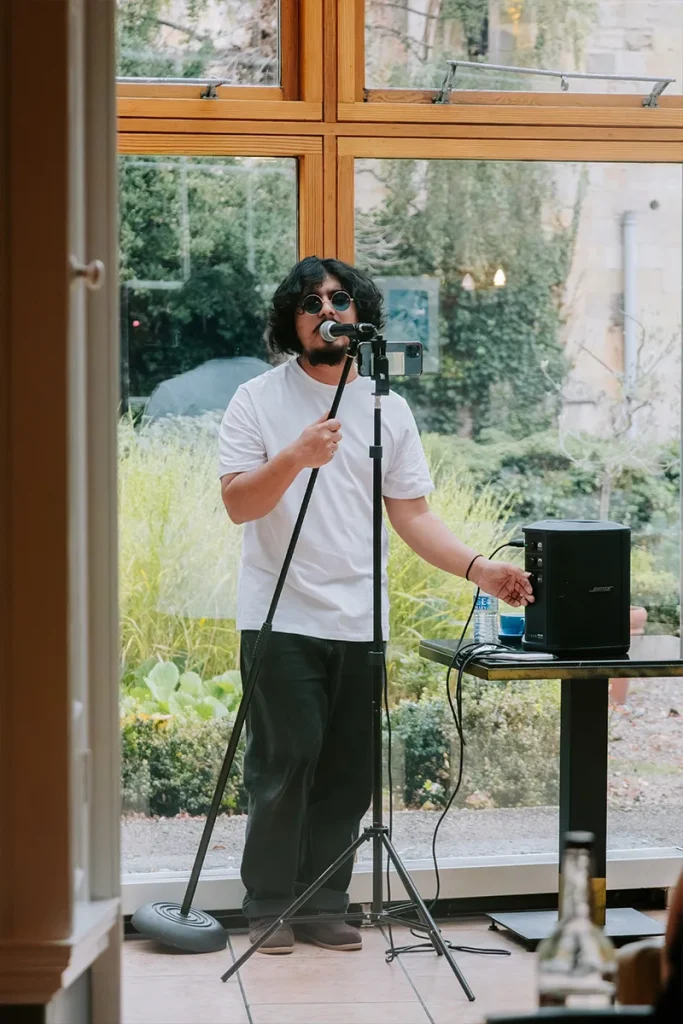 Live singer performing during an event at La Vecchia Scuola in York